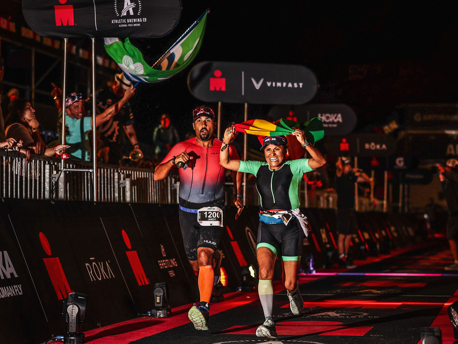 Andy Stainfield and Rose Pantoja on finishing line of Ironman event